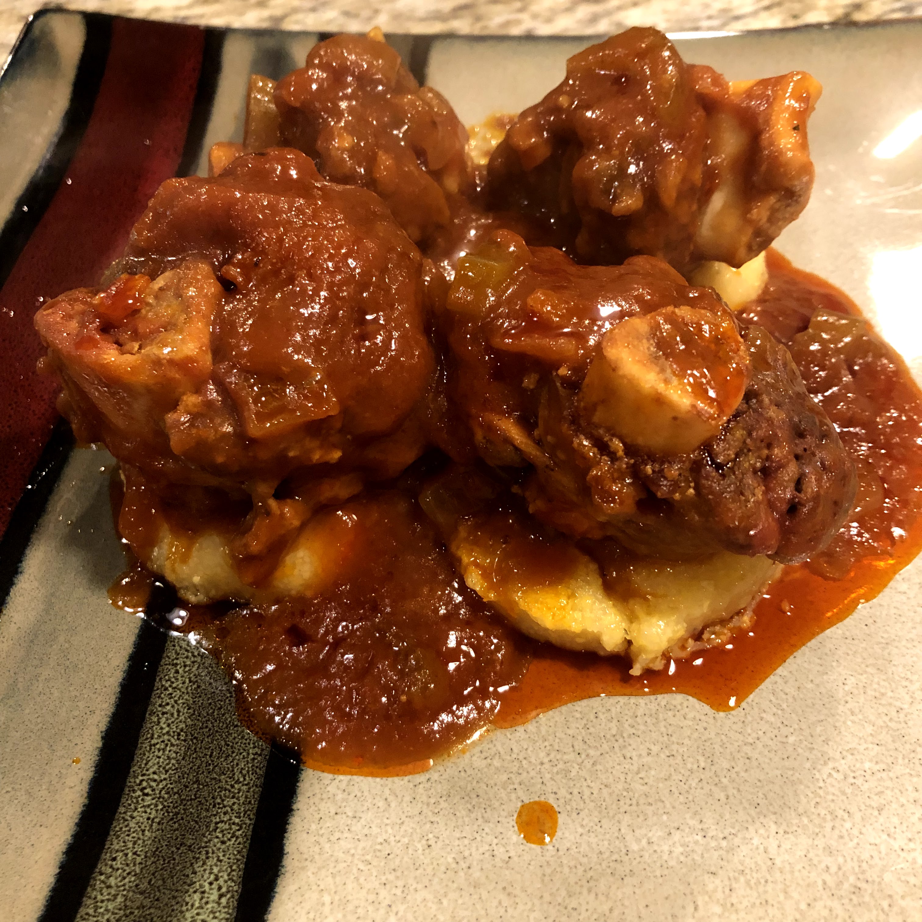 Venison Shank Osso Buco on a plate of polenta