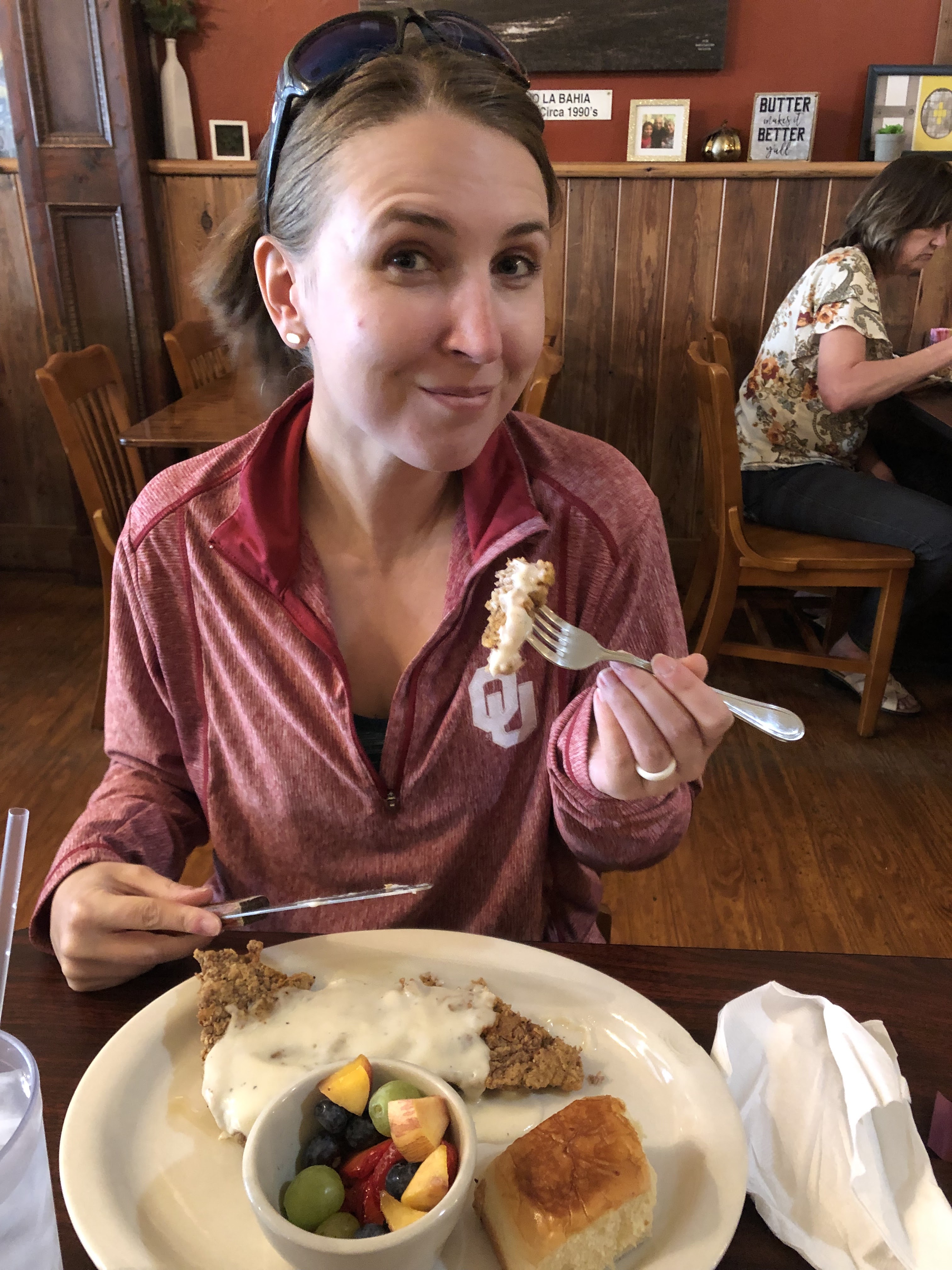 Jessica eating chicken fried steak and fruit for brunch at the Empresario