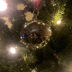 Christmas ornament in the shape of  a silver bell