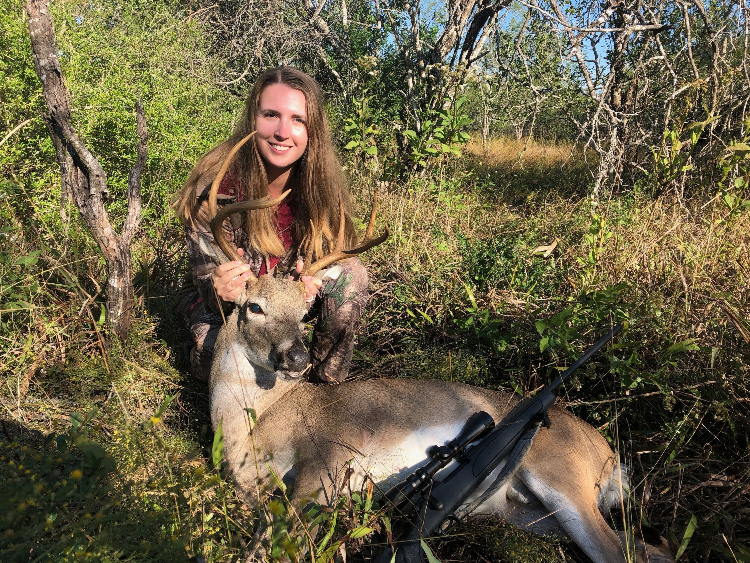 Jessica with Kicker, a whitetail buck
