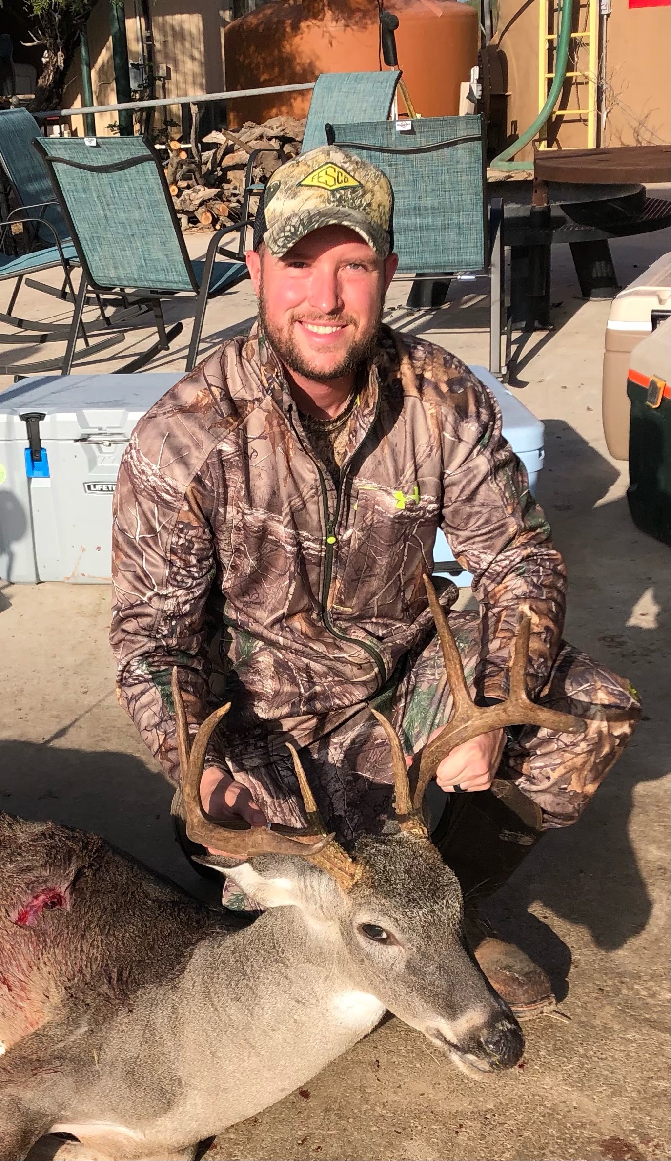 Court with an 8-point whitetail buck