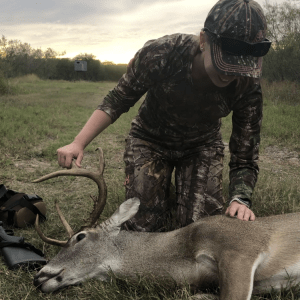 Jessica looking closer at the 8-point deer on the ground